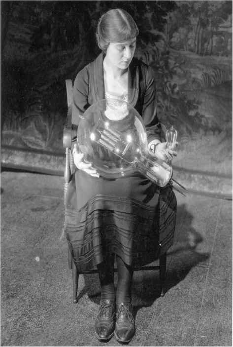 1920’s - Maude holding lighting for stage that she helped to improve